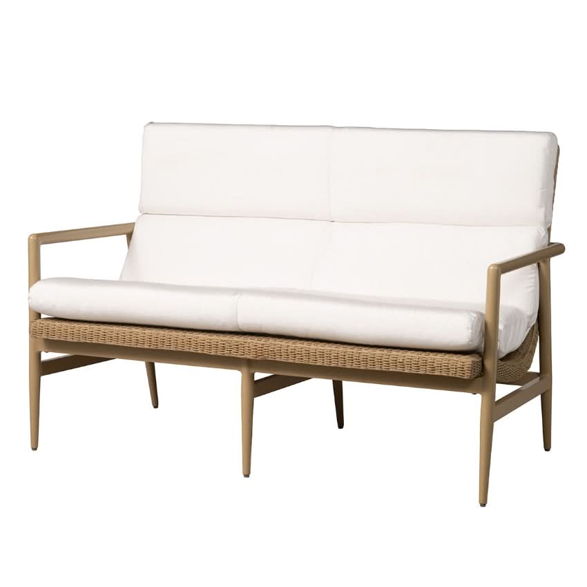 Wicker outdoor loveseat with white cushions on a white background