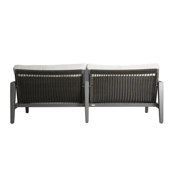 Back view of outdoor sofa with white cushions on a white background