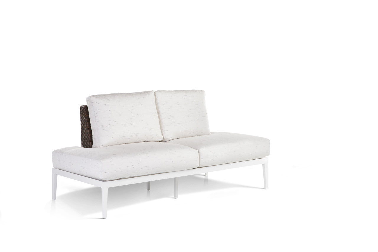 A white Stevie Wicker Loveseat with left side wraparound cushions set against a white background.