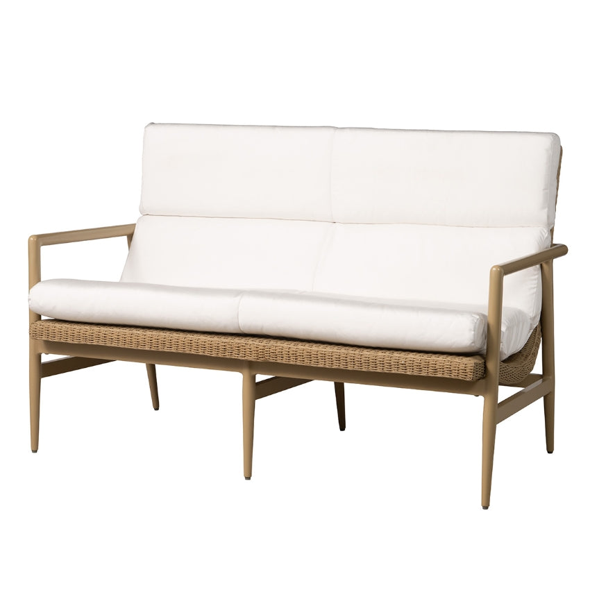 Wicker outdoor loveseat with white cushions on a white background