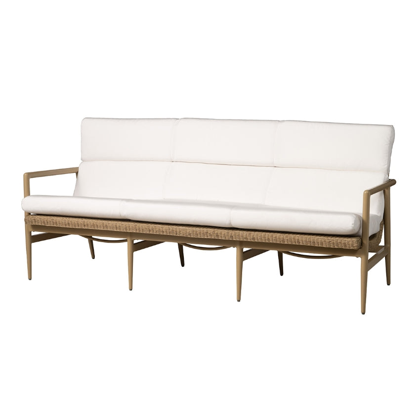 Wicker outdoor sofa with white cushions on a white background