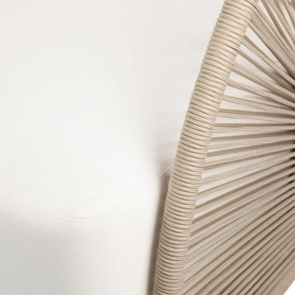 Close-up detail of a modern chair featuring a white upholstered seat and back with a curved, radiating beige rope or cord backrest.
